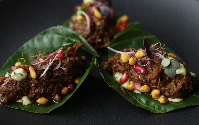 Kolhapuri slow cooked lamb on betel leaf, avocado, raita, crisp bondi 