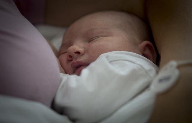 Aleksandra Milenovic watches her 24-hour-old baby Milica after breastfeeding her at the Obstetrics and gynecological Clinic "Narodni Front" in Belgrade. (AFP) Aleksandra Milenovic watches her 24-hour-old baby Milica after breastfeeding her at the Obstetrics and gynecological Clinic "Narodni Front" in Belgrade. (AFP)