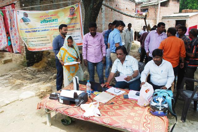 LESA officials completing formalities for power connections to the villagers LESA officials completing formalities for power connections to the villagers