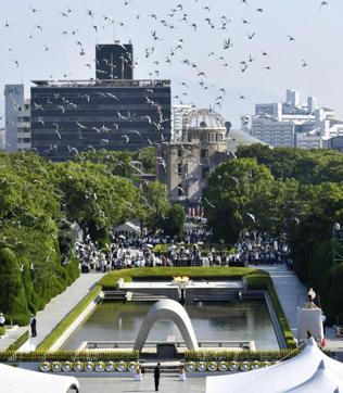 Doves fly over the cenotaph dedicated to the victims of the atomic bombing during a ceremony to mark the 73rd anniversary of the bombing at Hiroshima Peace Memorial Park in Hiroshima, on Monday. The Atomic Bomb Dome is seen in center background. (AP) Doves fly over the cenotaph dedicated to the victims of the atomic bombing during a ceremony to mark the 73rd anniversary of the bombing at Hiroshima Peace Memorial Park in Hiroshima, on Monday. The Atomic Bomb Dome is seen in center background. (AP)