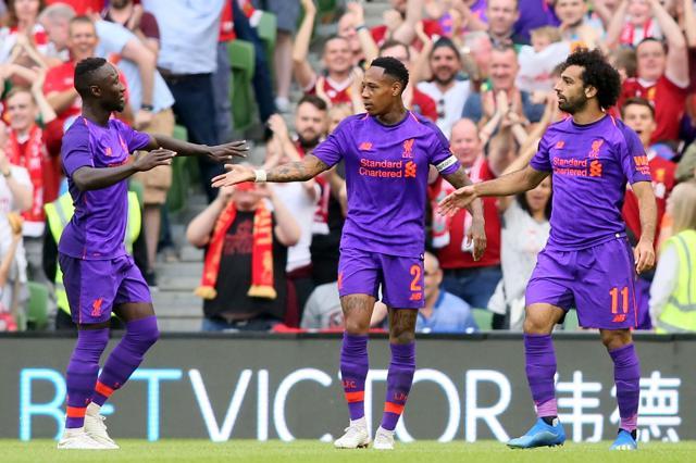 Liverpool's Egyptian midfielder Mohamed Salah (R) celebrates after scoring a goal. (AFP) Liverpool's Egyptian midfielder Mohamed Salah (R) celebrates after scoring a goal. (AFP)