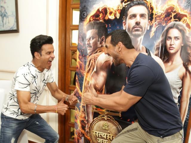 Manoj Bajpayee and John Abraham react during Satyameva Jayate promotion. (IANS) Manoj Bajpayee and John Abraham react during Satyameva Jayate promotion. (IANS)