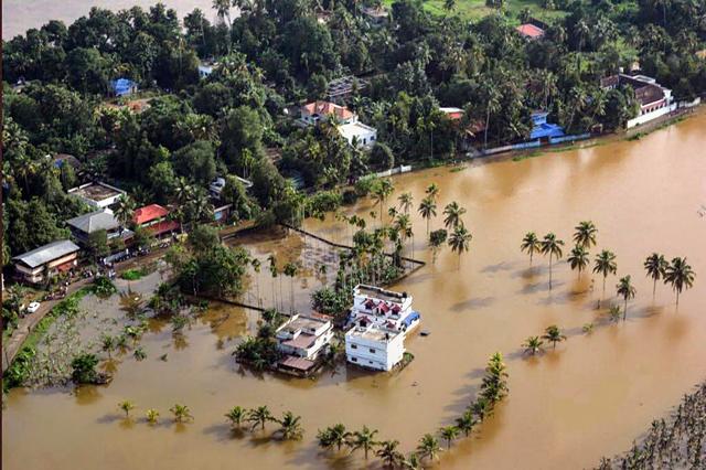 An aerial view of a flooded locality in Kerala’s Aluva after heavy rain on Friday. (PTI Photo) An aerial view of a flooded locality in Kerala’s Aluva after heavy rain on Friday. (PTI Photo)