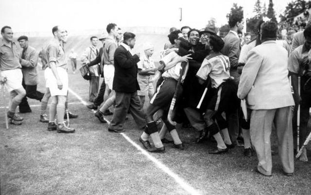 Members of the victorious Indian team are hugged by spectators after their win against Holland. (Popperfoto/Getty Images) Members of the victorious Indian team are hugged by spectators after their win against Holland. (Popperfoto/Getty Images)