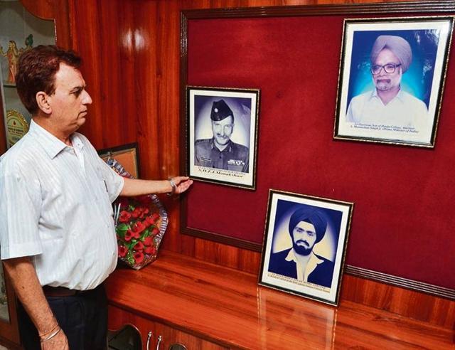 Principal PK Sharma with portraits of former Prime Minister Dr Manmohan Singh, Field Marshal Sam Manekshaw and legendary spinner Bishan Singh Bedi. Principal PK Sharma with portraits of former Prime Minister Dr Manmohan Singh, Field Marshal Sam Manekshaw and legendary spinner Bishan Singh Bedi.
