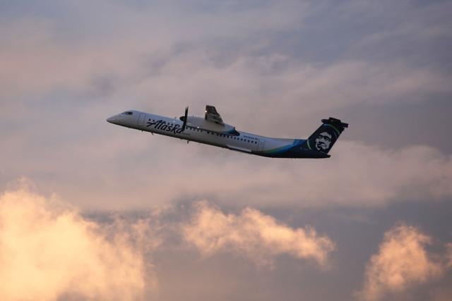 In file photo taken on August 11, 2018 an Alaska Airlines Bombardier Dash 8 Q400 operated by Horizon Air takes off from at Seattle-Tacoma International Airport International Airport one day after Horizon Air ground crew member Richard Russell took a similar plane from the airport in Seattle, Washington. (AFP)