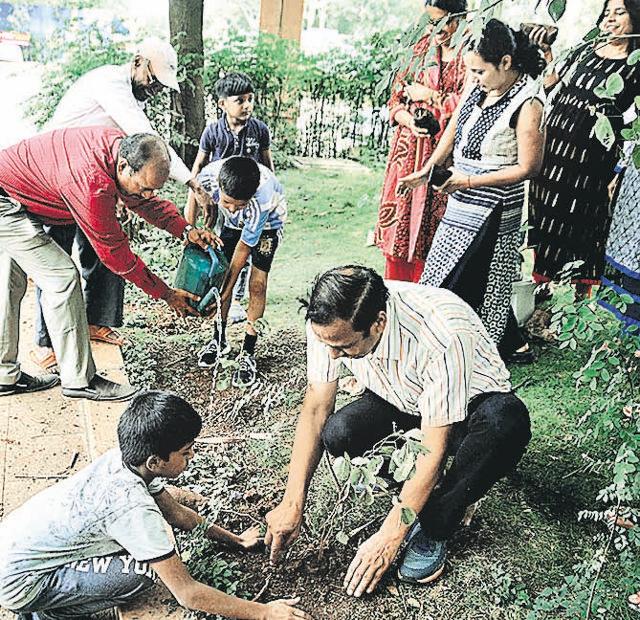 Residents of Bramha Sun city plant saplings during the drive. (Shankar Narayan/HT PHOTO) Residents of Bramha Sun city plant saplings during the drive. (Shankar Narayan/HT PHOTO)