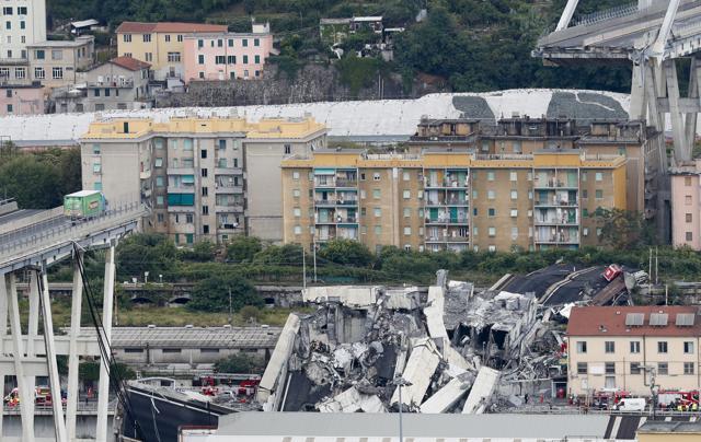 A view of the Morandi highway bridge after a section of it collapsed, in Genoa, northern Italy. (AP Photo) A view of the Morandi highway bridge after a section of it collapsed, in Genoa, northern Italy. (AP Photo)