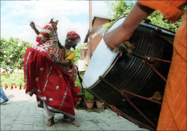 Folk dancers perform during the Teej Utsav at Dilli Haat. (KAUSHIK RAMASWAMY)
