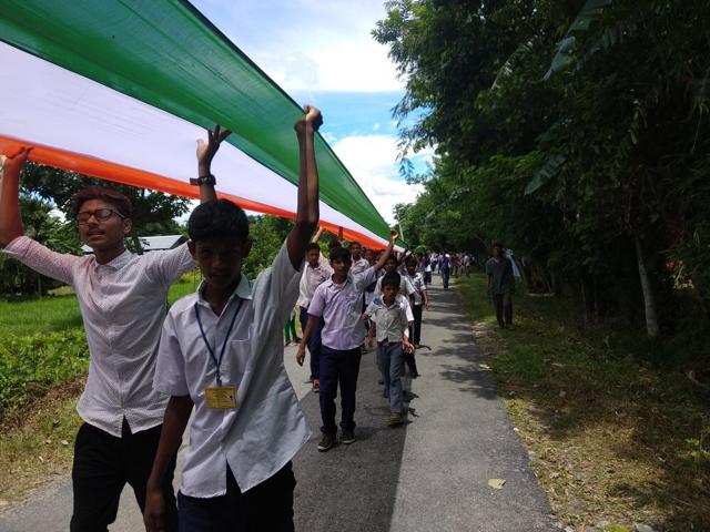Villagers from the Bodoland Territorial Administrative Districts (BTAD) in lower Assam, stitched up a 3.5 km long tricolour to celebrate Independence Day on Wednesday. (HT Photo) Villagers from the Bodoland Territorial Administrative Districts (BTAD) in lower Assam, stitched up a 3.5 km long tricolour to celebrate Independence Day on Wednesday. (HT Photo)