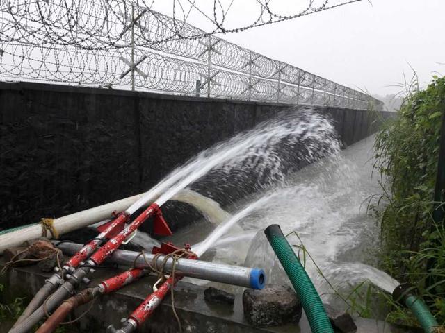 Water being pumped from the runway at the Cochin International Airport. Water being pumped from the runway at the Cochin International Airport.