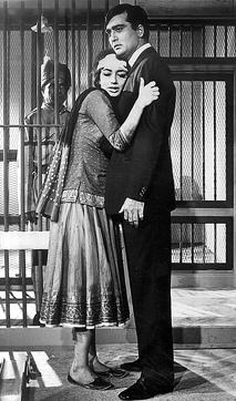In Mera Saaya, Khosla uses the Hitchcockian concept of look-alikes to create plot confusion. A young widower, a lawyer (Sunil Dutt), is traumatised when a woman caught by the cops for being a dacoit’s partner (Sadhana in a double role) claims to be his wife and demands that he defend her in court. (Photo: Indian Express archive ) In Mera Saaya, Khosla uses the Hitchcockian concept of look-alikes to create plot confusion. A young widower, a lawyer (Sunil Dutt), is traumatised when a woman caught by the cops for being a dacoit’s partner (Sadhana in a double role) claims to be his wife and demands that he defend her in court. (Photo: Indian Express archive )