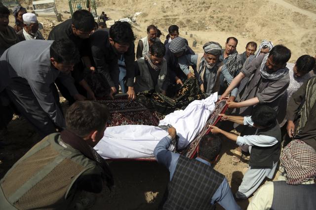 Afghan men bury a victim of Wednesday's deadly suicide bombing that targeted a training class in a private building in the Shiite neighborhood of Dasht-i Barcha, in western Kabul, Afghanistan. (AP) Afghan men bury a victim of Wednesday's deadly suicide bombing that targeted a training class in a private building in the Shiite neighborhood of Dasht-i Barcha, in western Kabul, Afghanistan. (AP)