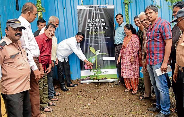 Tree plantation at Nano Space housing society in Ravet on Sunday. (HT Photo) Tree plantation at Nano Space housing society in Ravet on Sunday. (HT Photo)