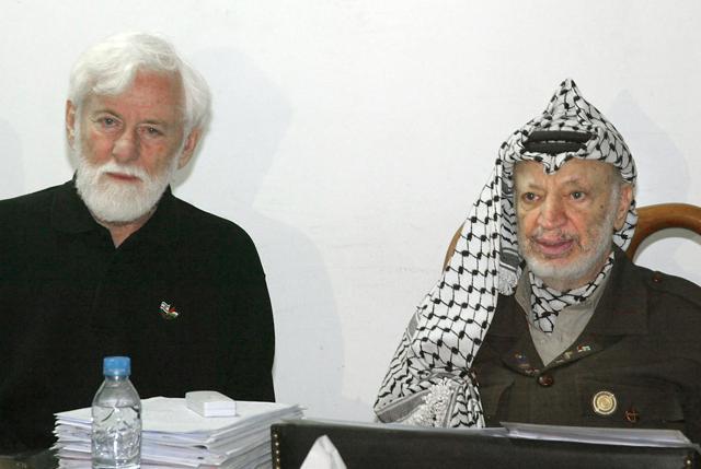 In this photo taken on May 9, 2002, Yasser Arafat (R) looks on during a meeting with Avnery at his office inside his partially destroyed compound in the West Bank city of Ramallah. (AFP) In this photo taken on May 9, 2002, Yasser Arafat (R) looks on during a meeting with Avnery at his office inside his partially destroyed compound in the West Bank city of Ramallah. (AFP)