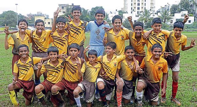 St Vincent's under-14 football team pose after the final win on Monday. (HT PHOTO)