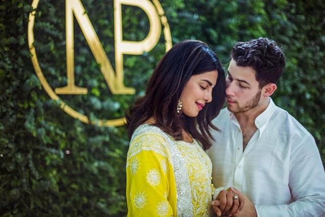 Priyanka Chopra and American singer Nick Jonas during a ceremony to perform pre-wedding rituals at her Juhu residence, in Mumbai on Saturday. (PTI) Priyanka Chopra and American singer Nick Jonas during a ceremony to perform pre-wedding rituals at her Juhu residence, in Mumbai on Saturday. (PTI)