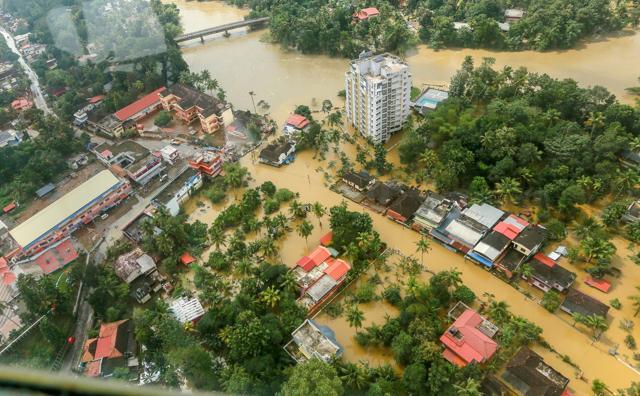 Flood affected areas of Chengannur seen from a Indian Navy helicopter, at Alappuzha district of the Kerala, on Sunday. (PTI) Flood affected areas of Chengannur seen from a Indian Navy helicopter, at Alappuzha district of the Kerala, on Sunday. (PTI)