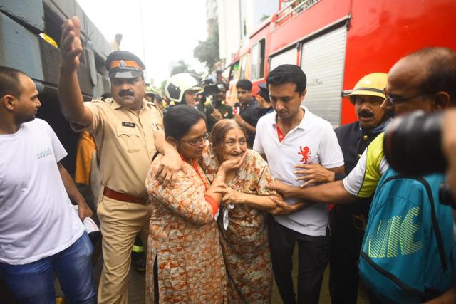 An elderly woman rescued from the top floors of the building. (Pratik Chorge/HT Photo) An elderly woman rescued from the top floors of the building. (Pratik Chorge/HT Photo)