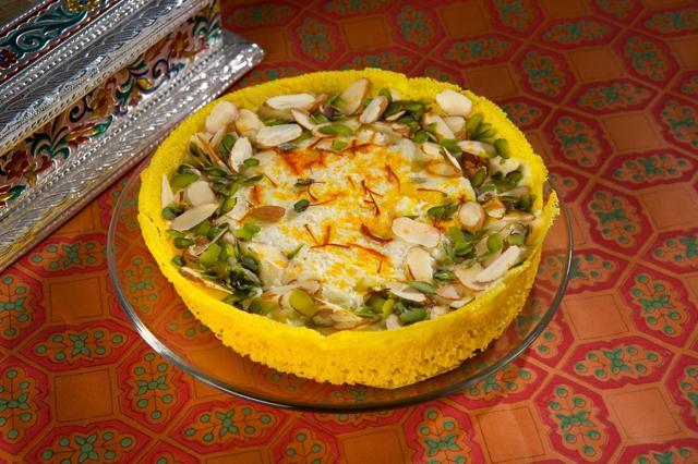 Kesar ghevar is made with pure ghee, topped with saffron and dry fruits. (Shutterstock)