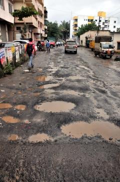Potholes at Dhayari- Narhe road in Pune on Wednesday. (HT PHOTO) Potholes at Dhayari- Narhe road in Pune on Wednesday. (HT PHOTO)