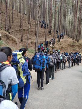 Participants at the camp with heavy rucksacks on their backs. Participants at the camp with heavy rucksacks on their backs.