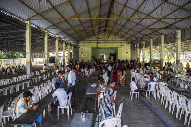 Flood victims gather in a dining hall at a relief camp set up at Sree Narayana College Cherthala, affiliated to the University of Kerala, in Alappuzha. (Bloomberg) Flood victims gather in a dining hall at a relief camp set up at Sree Narayana College Cherthala, affiliated to the University of Kerala, in Alappuzha. (Bloomberg)