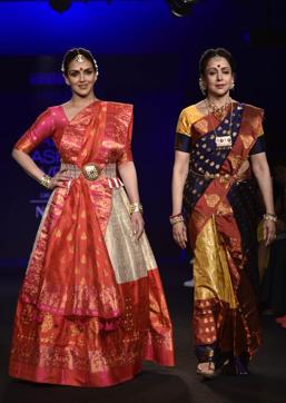 Hema Malini with daughter Esha Deol showcases a creation by designer Sanjukta Dutta at the Lakmé Fashion Week (LFW) Winter Festive 2018 in Mumbai. (AFP) Hema Malini with daughter Esha Deol showcases a creation by designer Sanjukta Dutta at the Lakmé Fashion Week (LFW) Winter Festive 2018 in Mumbai. (AFP)