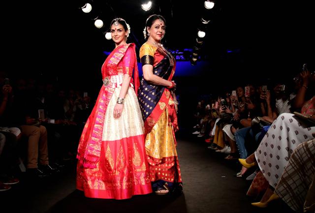 Hema Malini and daughter Esha Deol walk the ramp. (PTI) Hema Malini and daughter Esha Deol walk the ramp. (PTI)