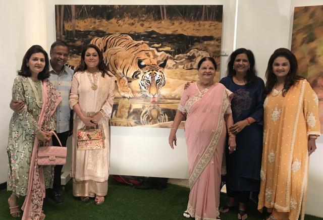 (From left) Nina Kothari, Anand Jain, Tina Ambani, Kokilaben Ambani, Sushma Jain, Dipti Salgaoncar , in front of one of Jain’s canvasses. (From left) Nina Kothari, Anand Jain, Tina Ambani, Kokilaben Ambani, Sushma Jain, Dipti Salgaoncar , in front of one of Jain’s canvasses.