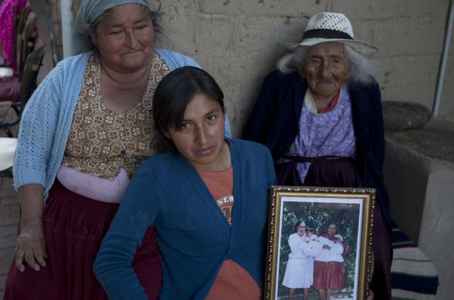 Julia Flores Colque, behind right, poses for a photo with her grandniece Agustina Berna, left, and her great-grandniece Rosa Lucas at their home in Sacaba, Bolivia. (AP) Julia Flores Colque, behind right, poses for a photo with her grandniece Agustina Berna, left, and her great-grandniece Rosa Lucas at their home in Sacaba, Bolivia. (AP)