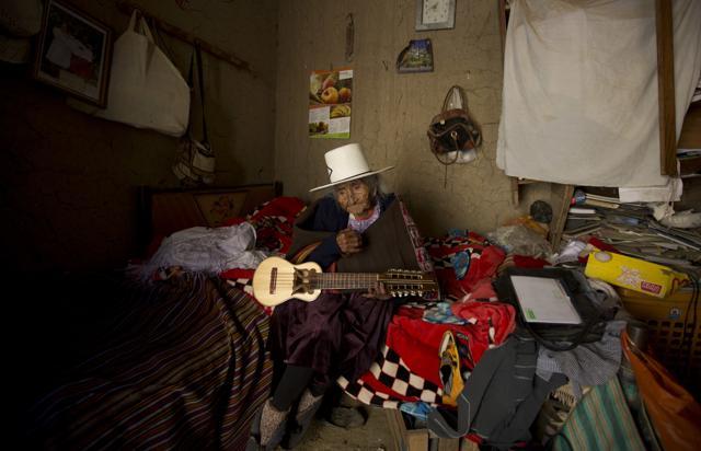Julia Flores Colque holds a "charango," a small Andean stringed instrument, at her home in Sacaba, Bolivia. (AP) Julia Flores Colque holds a "charango," a small Andean stringed instrument, at her home in Sacaba, Bolivia. (AP)