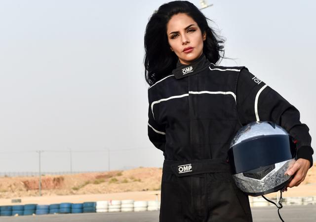 Rana Almimoni, a 30-year-old Saudi motor racing enthusiast, poses with her helmet on the track in Dirab motor park, on the southern outskirts of the capital Riyadh, on July 19, 2018. (AFP) Rana Almimoni, a 30-year-old Saudi motor racing enthusiast, poses with her helmet on the track in Dirab motor park, on the southern outskirts of the capital Riyadh, on July 19, 2018. (AFP)