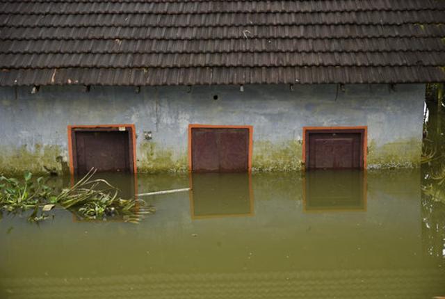 A house is seen partially submerged in water as flood waters recede in Kuttanad, Alappuzha. (AP Photo) A house is seen partially submerged in water as flood waters recede in Kuttanad, Alappuzha. (AP Photo)