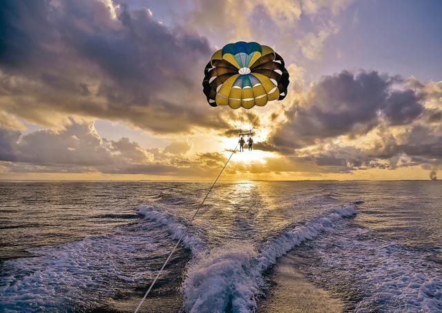 Discover sea life by parasailing over the reefs beaming at you (Swapan Seth) Discover sea life by parasailing over the reefs beaming at you (Swapan Seth)