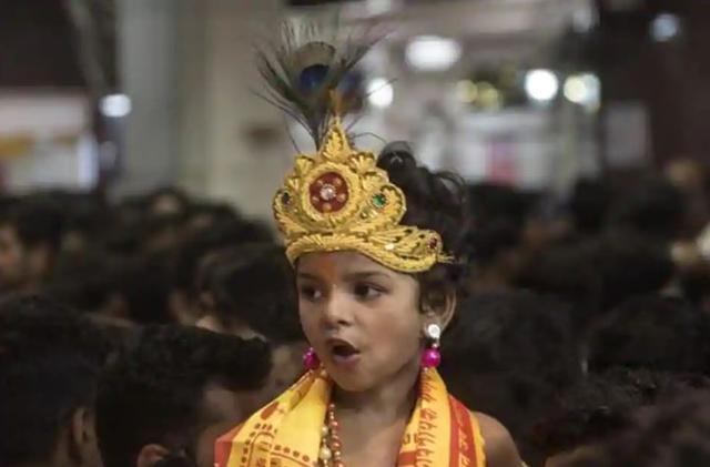 A child dressed as Lord Krishna as part of the festivities. (HT File)