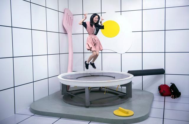 A visitor at the egg-themed pop-up exhibition in Shanghai. (AFP) A visitor at the egg-themed pop-up exhibition in Shanghai. (AFP)