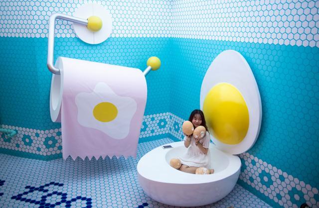 A visitor poses at The Egg House in Shanghai. (AFP) A visitor poses at The Egg House in Shanghai. (AFP)
