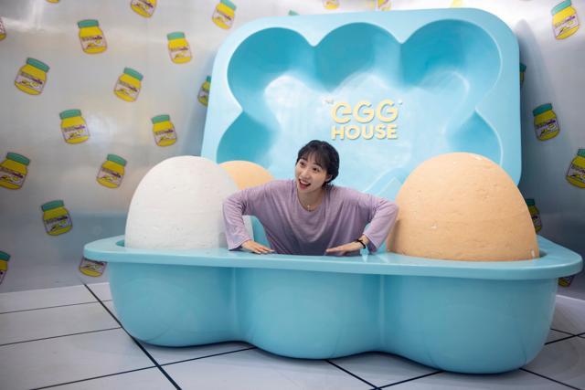 A visitor poses at The Egg House in Shanghai. (AFP) A visitor poses at The Egg House in Shanghai. (AFP)