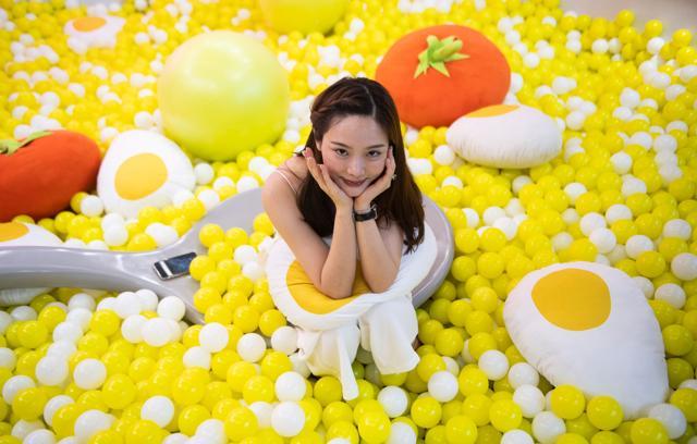 A visitor poses at The Egg House in Shanghai. (AFP) A visitor poses at The Egg House in Shanghai. (AFP)