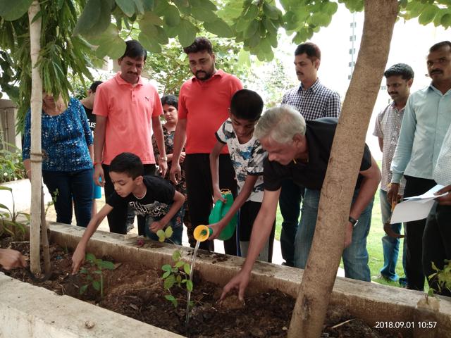 Residents of all age groups gathered for the tree plantation drive at Mount N Glory co-op housing society limited, Kharadi. (HT PHOTO) Residents of all age groups gathered for the tree plantation drive at Mount N Glory co-op housing society limited, Kharadi. (HT PHOTO)