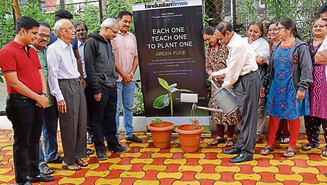 Residents of Sylvan retreat apartment, Range hills, during the tree plantation drive organised at the society by Hindustan Times, Pune edition. (HT PHOTO) Residents of Sylvan retreat apartment, Range hills, during the tree plantation drive organised at the society by Hindustan Times, Pune edition. (HT PHOTO)