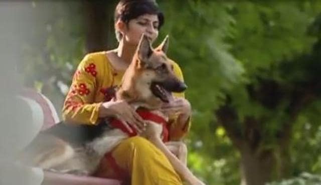 Sonia with her German Shepherd dog.