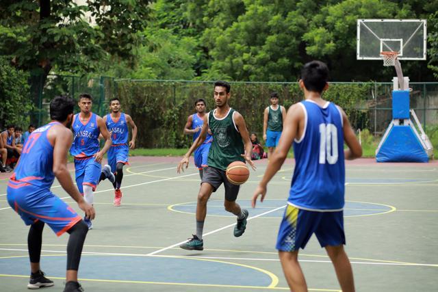 A basketball match between Hansraj and Hindu College underway. (Amal KS/HT Photo)