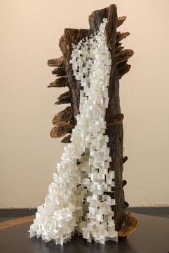 Sachin Tekade’s sculpture titled Aadhar juxtaposes small squares of paper with a wooden log to depict the binaries of man-made and natural forms. Sachin Tekade’s sculpture titled Aadhar juxtaposes small squares of paper with a wooden log to depict the binaries of man-made and natural forms.