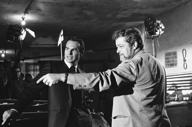 In this May 27, 1966 file photo, actor Burt Reynolds, left, discusses a scene with director Paul Bogart during location shooting of a new ABC-TV series Hawk, in New York. (AP) In this May 27, 1966 file photo, actor Burt Reynolds, left, discusses a scene with director Paul Bogart during location shooting of a new ABC-TV series Hawk, in New York. (AP)
