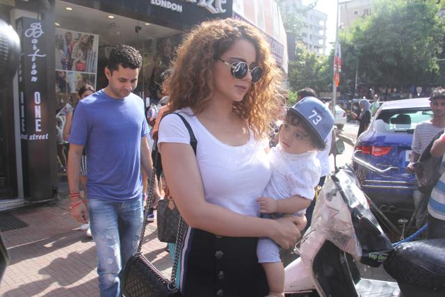 Kangana Ranaut with her nephew Prithvi Raj at Bastian, Mumbai. Kangana Ranaut with her nephew Prithvi Raj at Bastian, Mumbai.