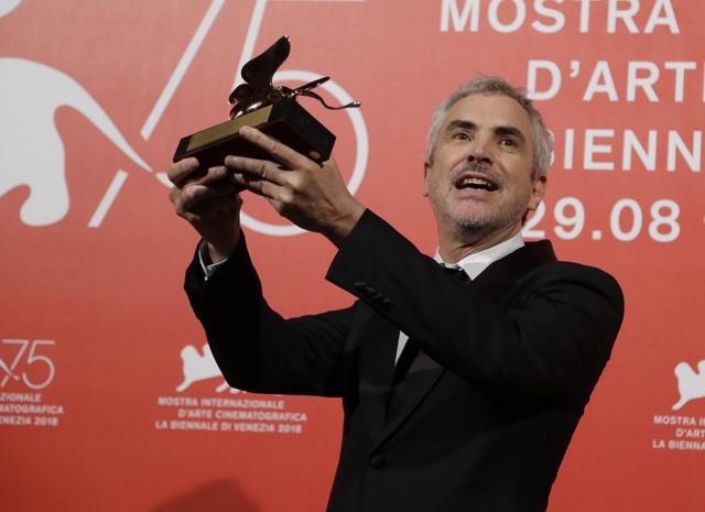 Director Alfonso Cuaron holds aloft the Golden Lion Best Film award for Roma at the awards photo call of the 75th edition of the Venice Film Festival in Venice. (AP) Director Alfonso Cuaron holds aloft the Golden Lion Best Film award for Roma at the awards photo call of the 75th edition of the Venice Film Festival in Venice. (AP)