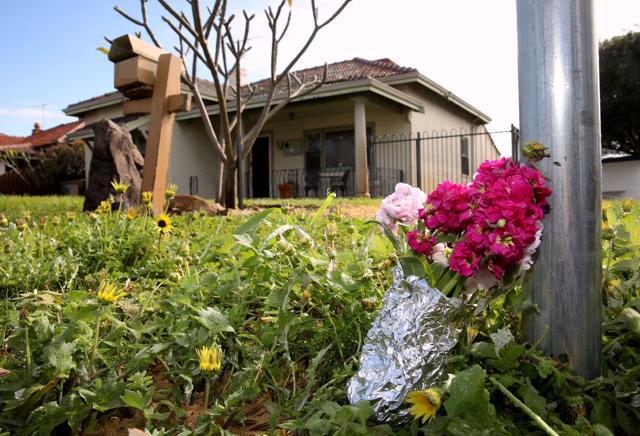 A bunch of flowers is seen outside a property where five people were found dead in a suburb of Perth. (REUTERS) A bunch of flowers is seen outside a property where five people were found dead in a suburb of Perth. (REUTERS)