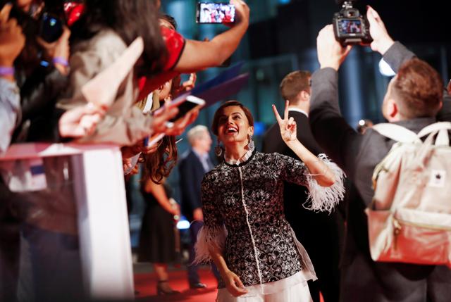 Actor Taapsee Pannu greets fans as she arrives for the premiere of Husband Material at the Toronto International Film Festival in Toronto, Ontario, Canada, September 11, 2018. (REUTERS)